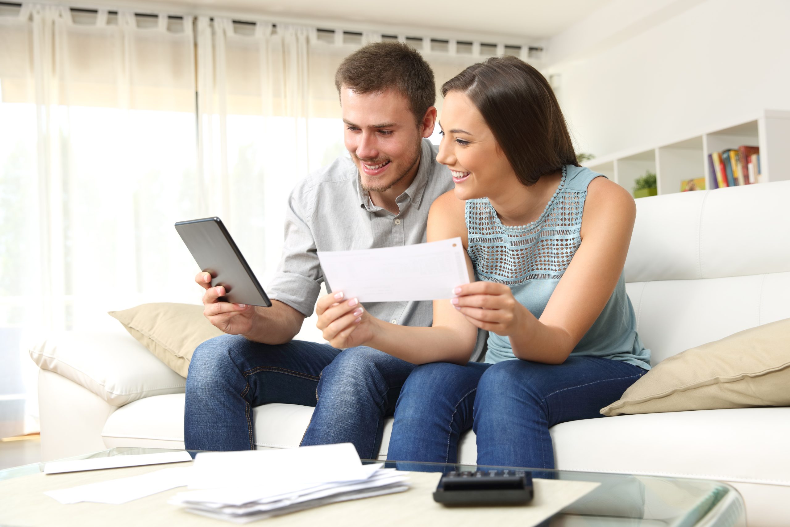 Happy,Couple,Checking,Bank,Account,On,Line,In,A,Tablet