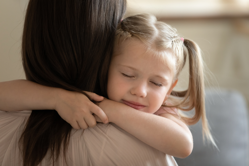 Close,Up,Of,Sweet,Small,Preschooler,Girl,Embrace,Young,Mother